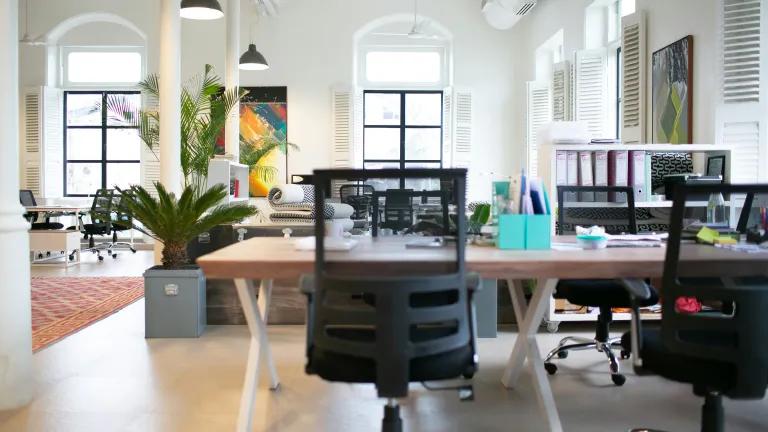 An empty office with desks and chairs