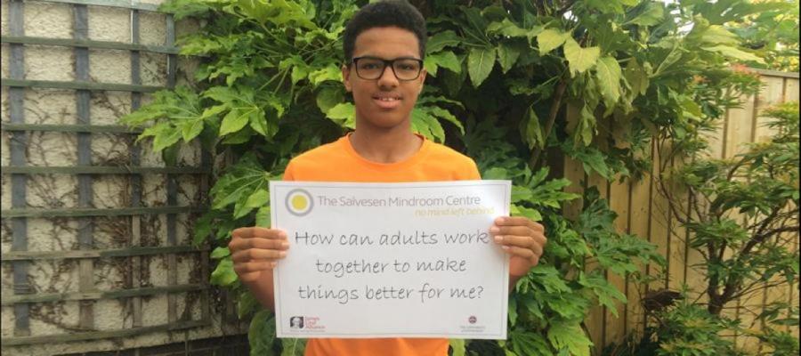 Young man holding up sign Salvesen Mindroom Centre