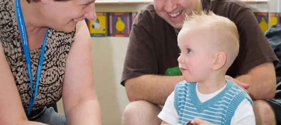 health professional assessing young child