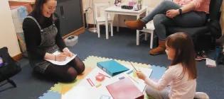 Researcher and participant in Dart Lab