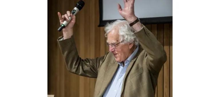 Photo of Alastair Salvesen waving hands in air