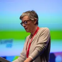 Photo of female speaker at lecturn